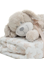 Cão de peluche com manta